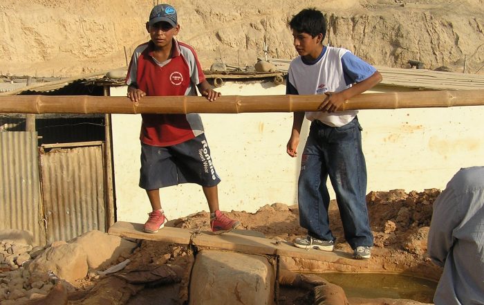 Children often work in the Quimbelete Pits amalgamating mercury with gold dust.